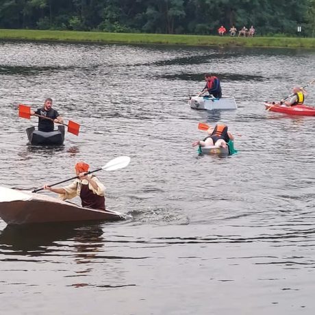 people playing boat races in the pond at Sparrow Pond Family Campground